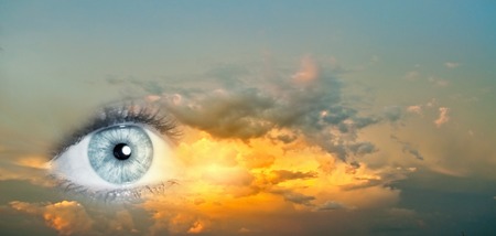 42165959 - female clear eye on blue sky background